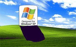 Windows XP logo as a gravestone against Windows XP desktop background